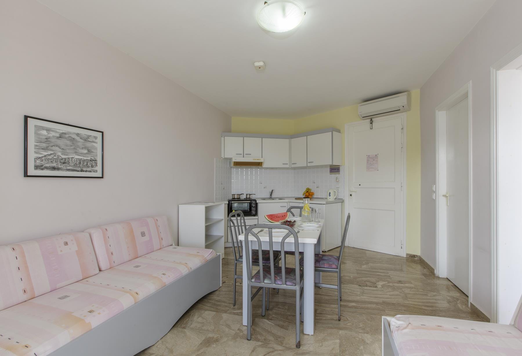 a room with a table and chairs