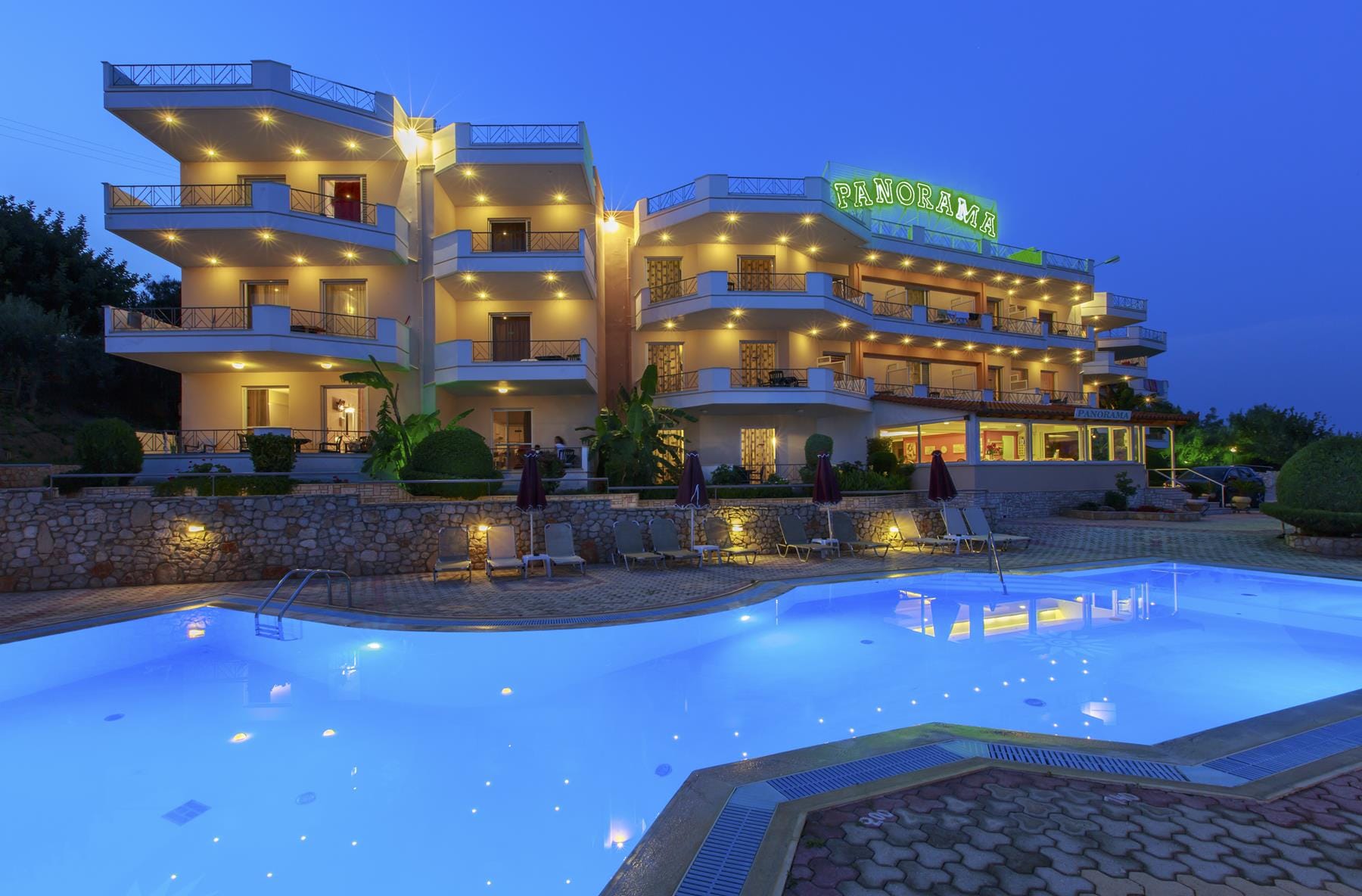 a large hotel with a pool