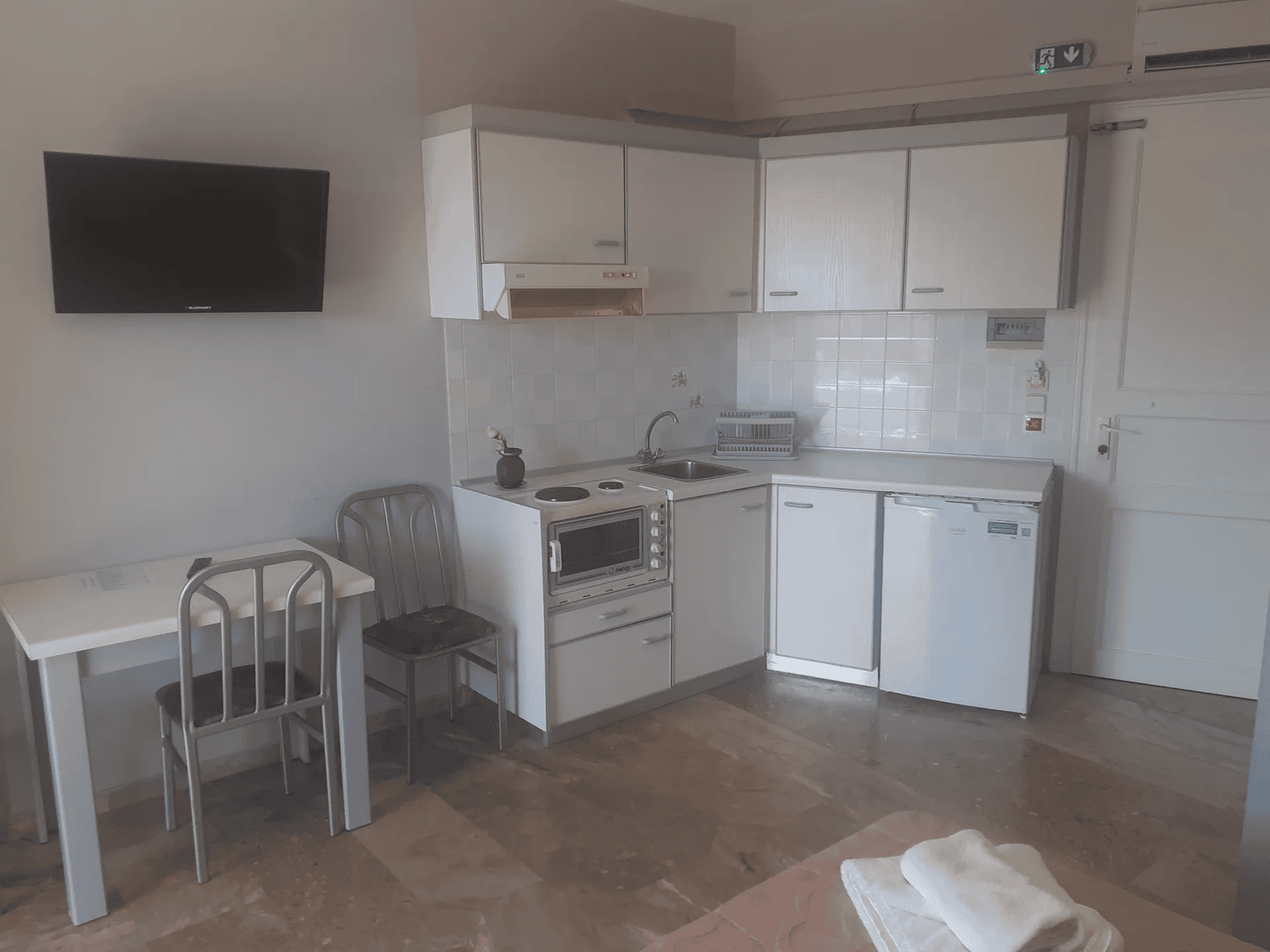 a kitchen with white cabinets