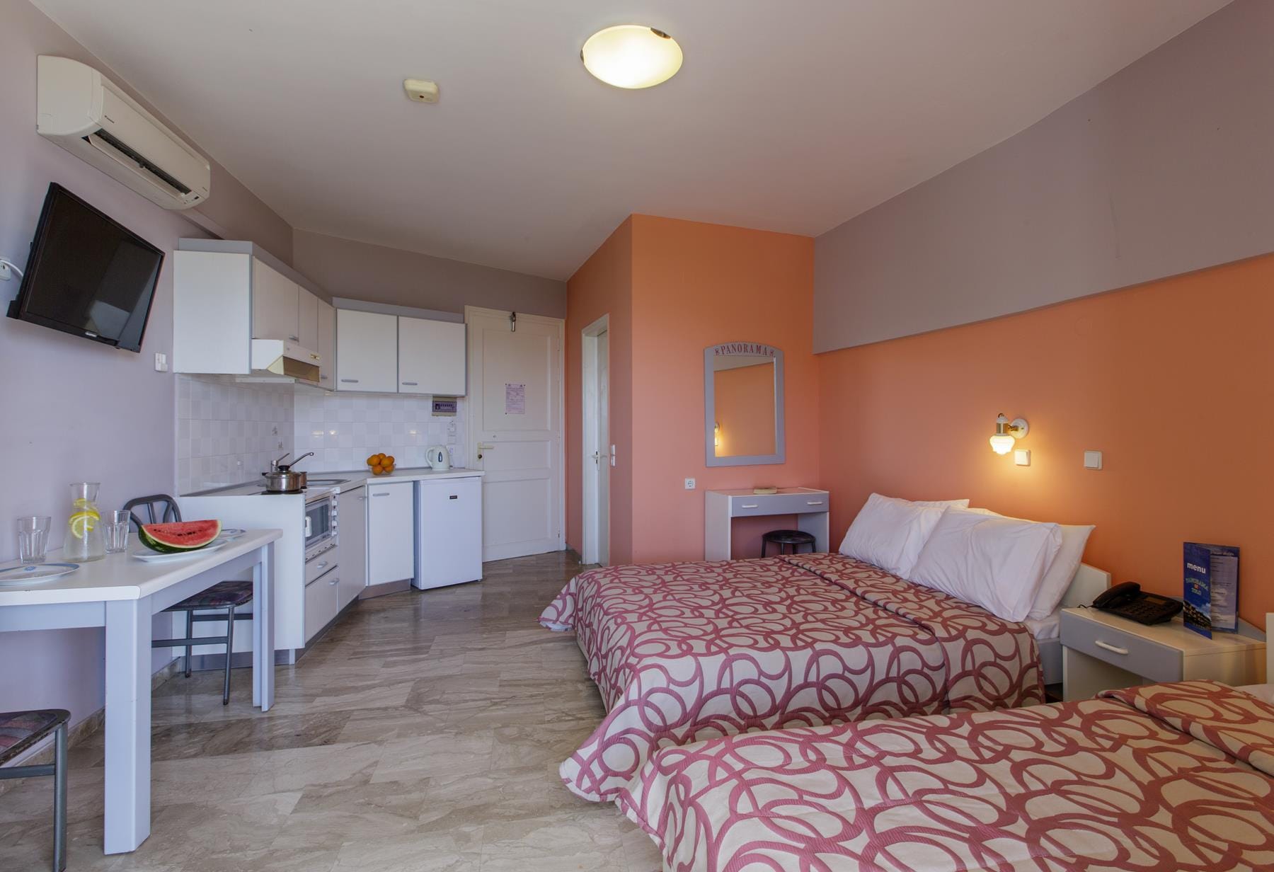 a bedroom with a bed and a table