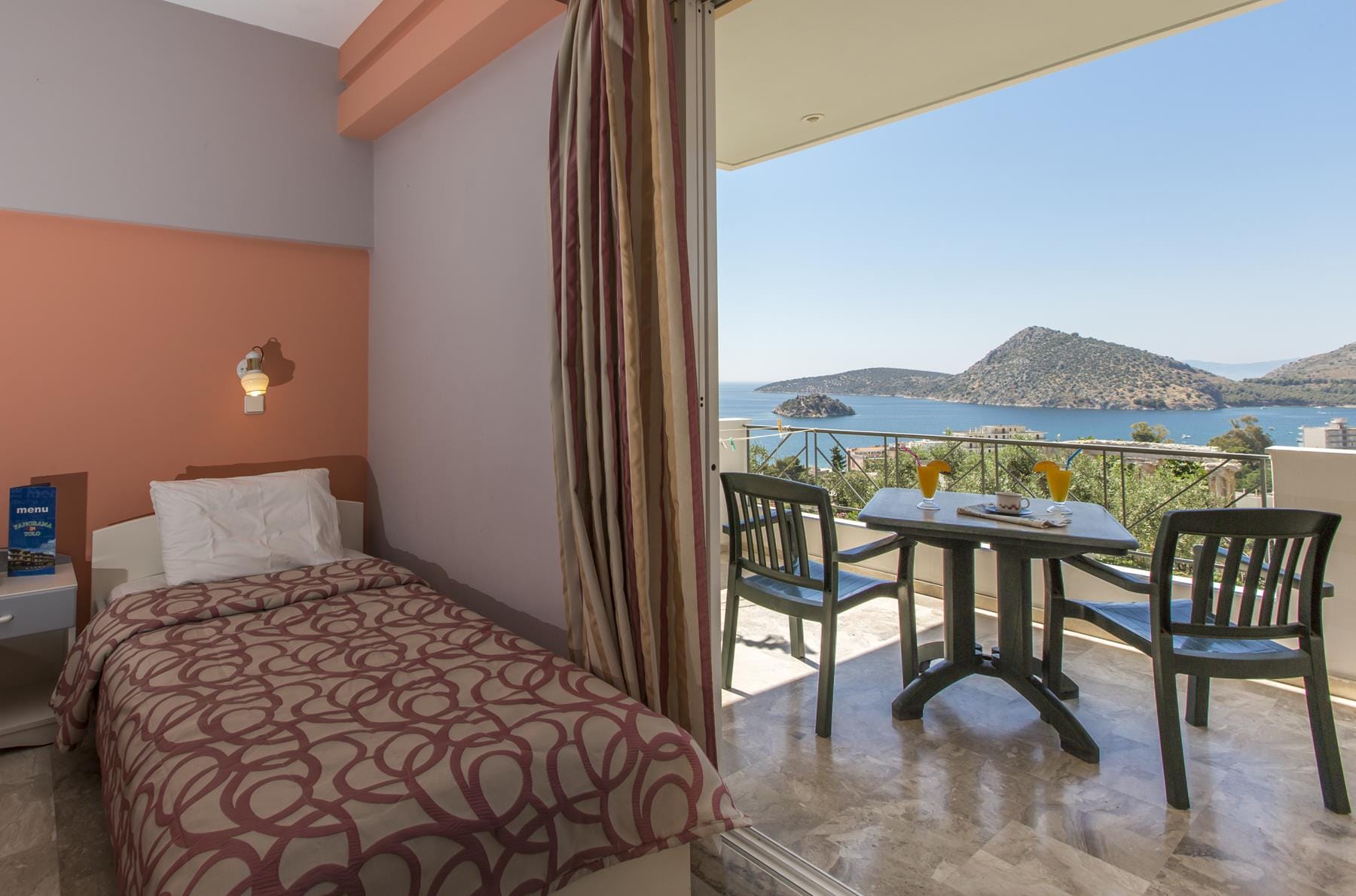 a bedroom with a bed and a table