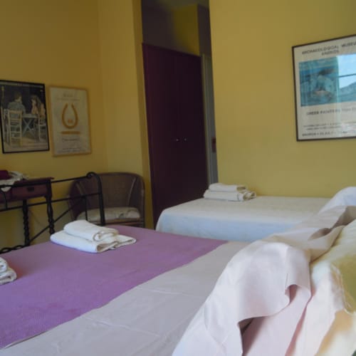 a couple of beds in a hotel room