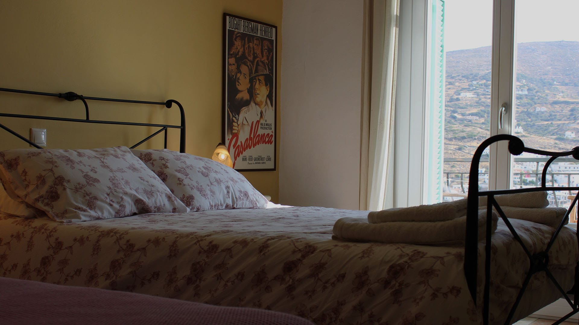 a bed with a pink comforter