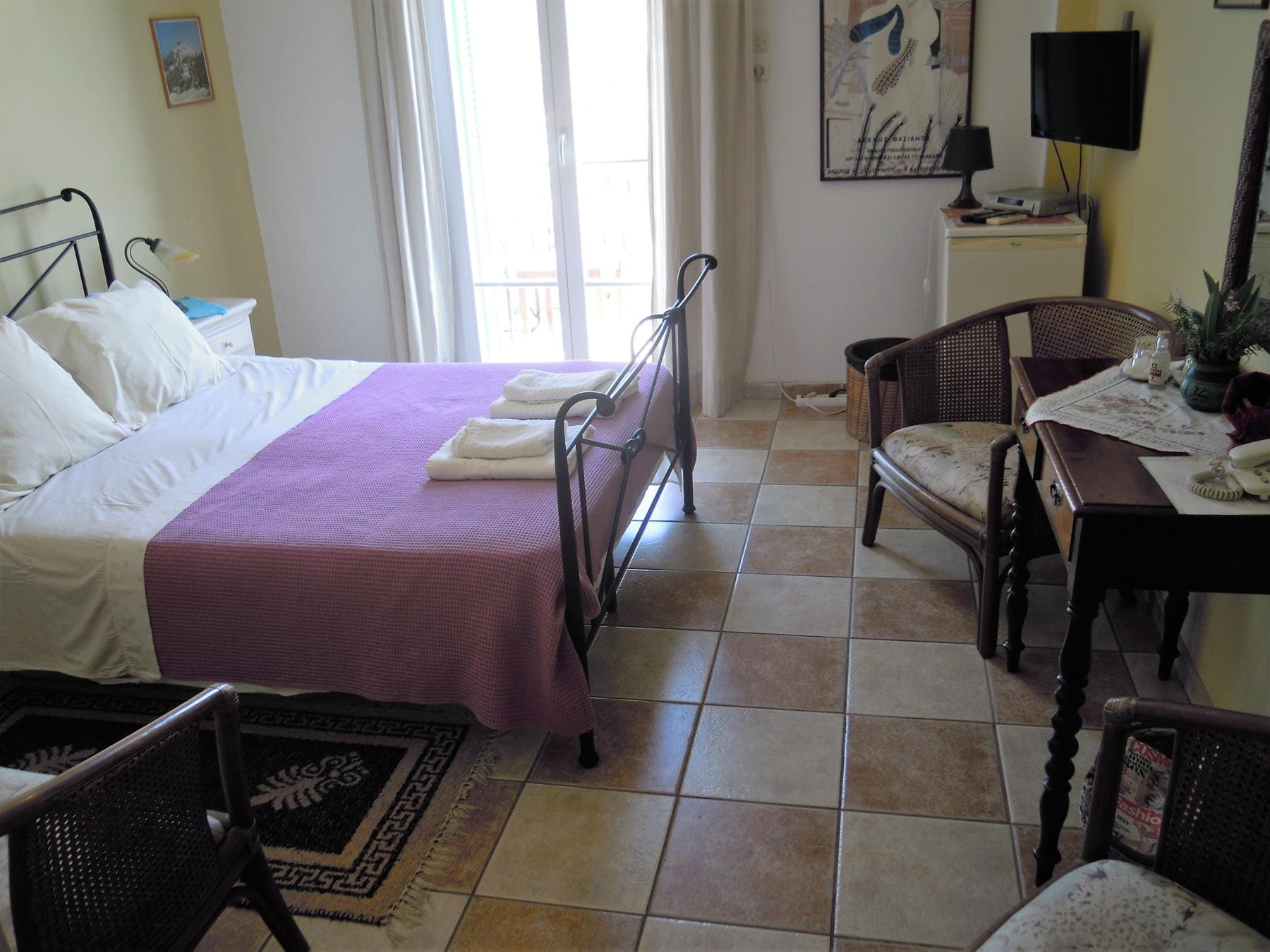 a bedroom with a bed and a desk