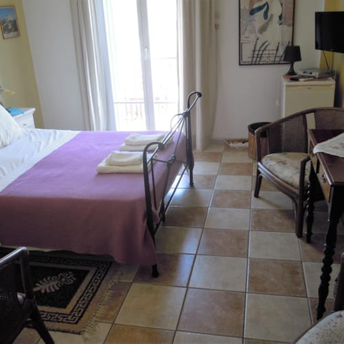 a bedroom with a bed and a desk