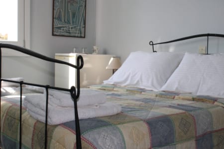 a couple of beds in a room