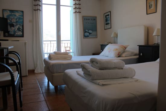 a hotel room with two beds