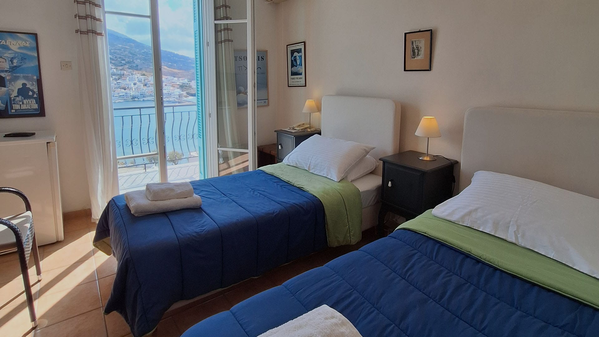 a couple of beds in a room