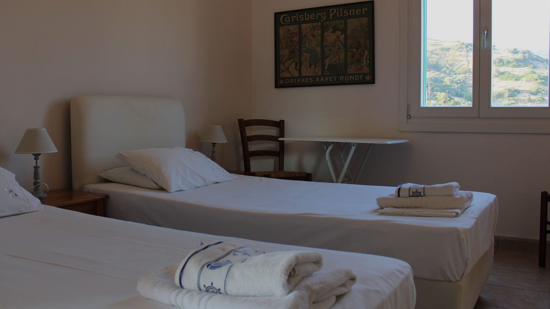 a hotel room with two beds