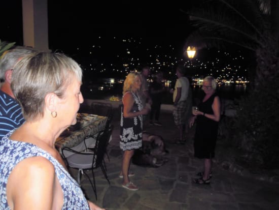 a group of people standing outside at night