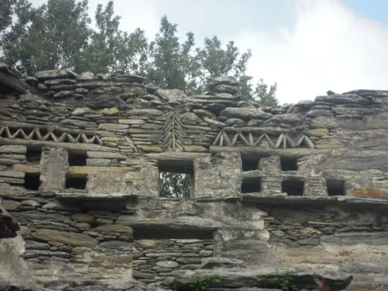 a stone building with a sign on it