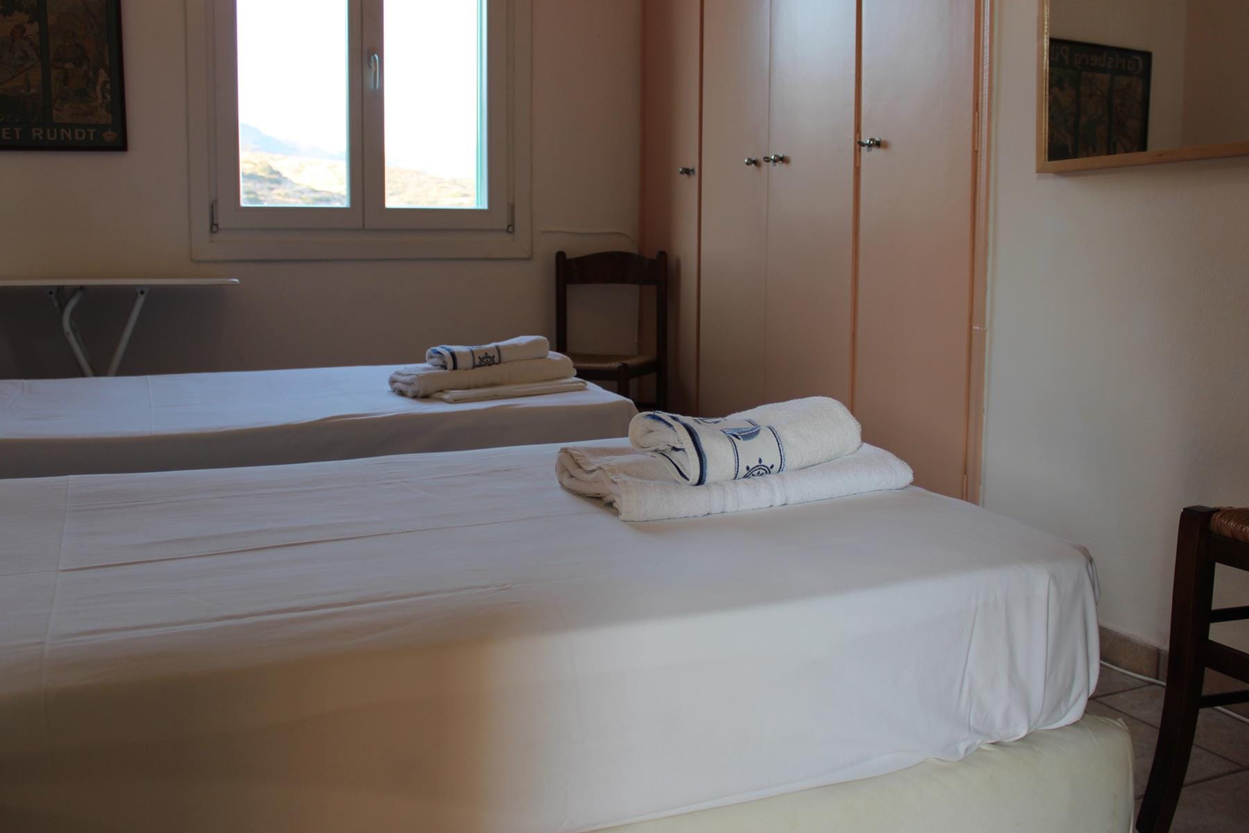 a couple of beds in a room