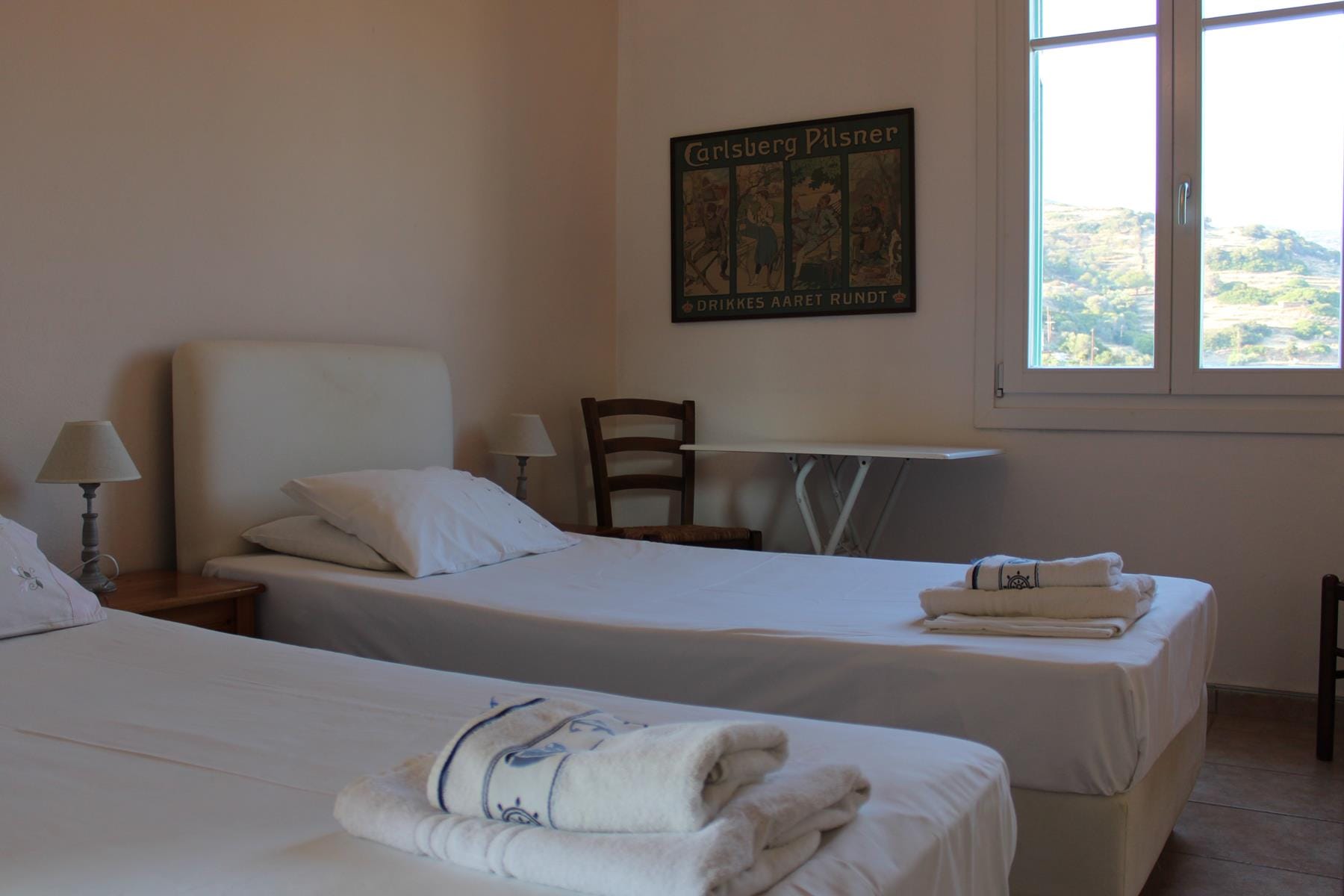 a hotel room with two beds