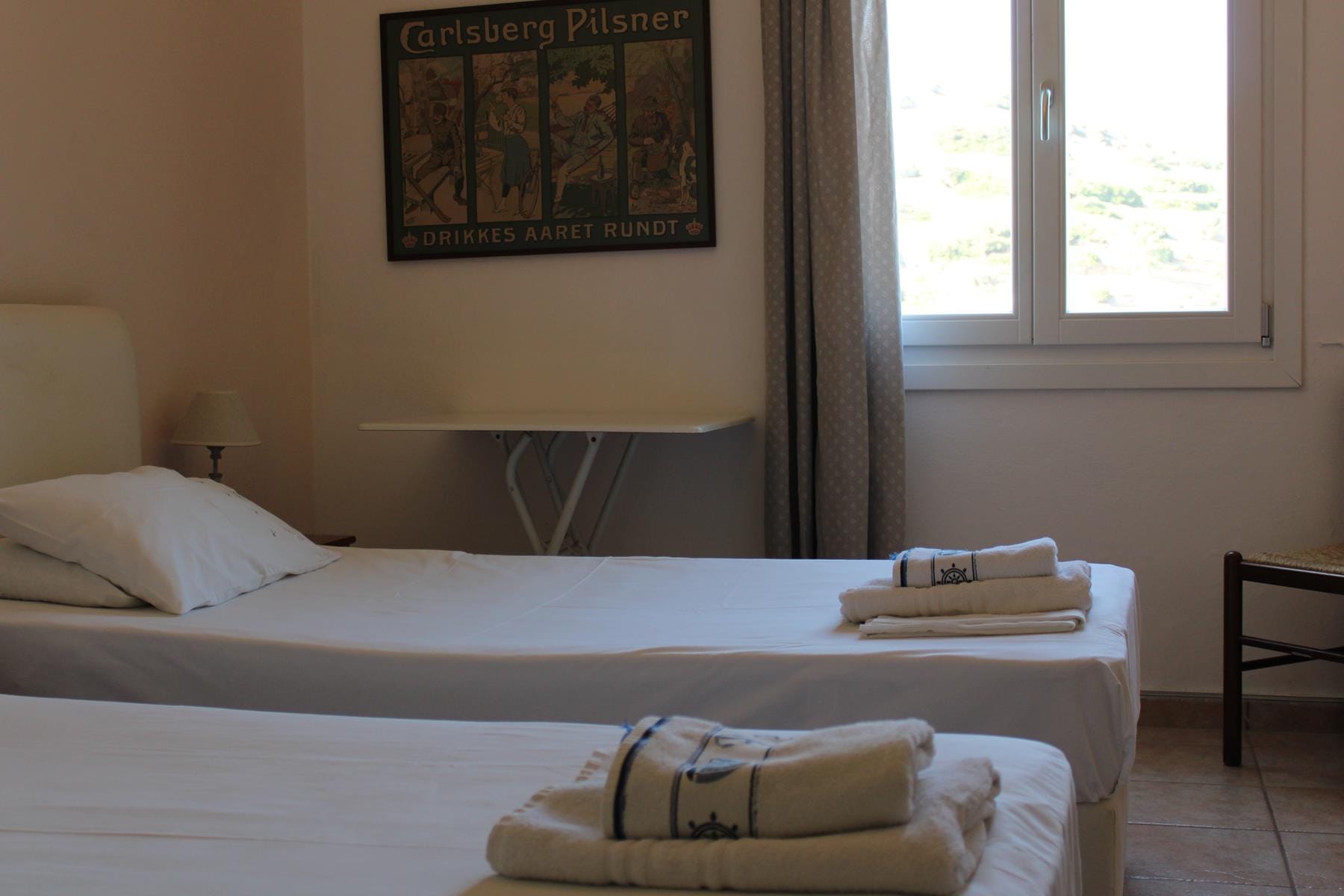 a hotel room with two beds