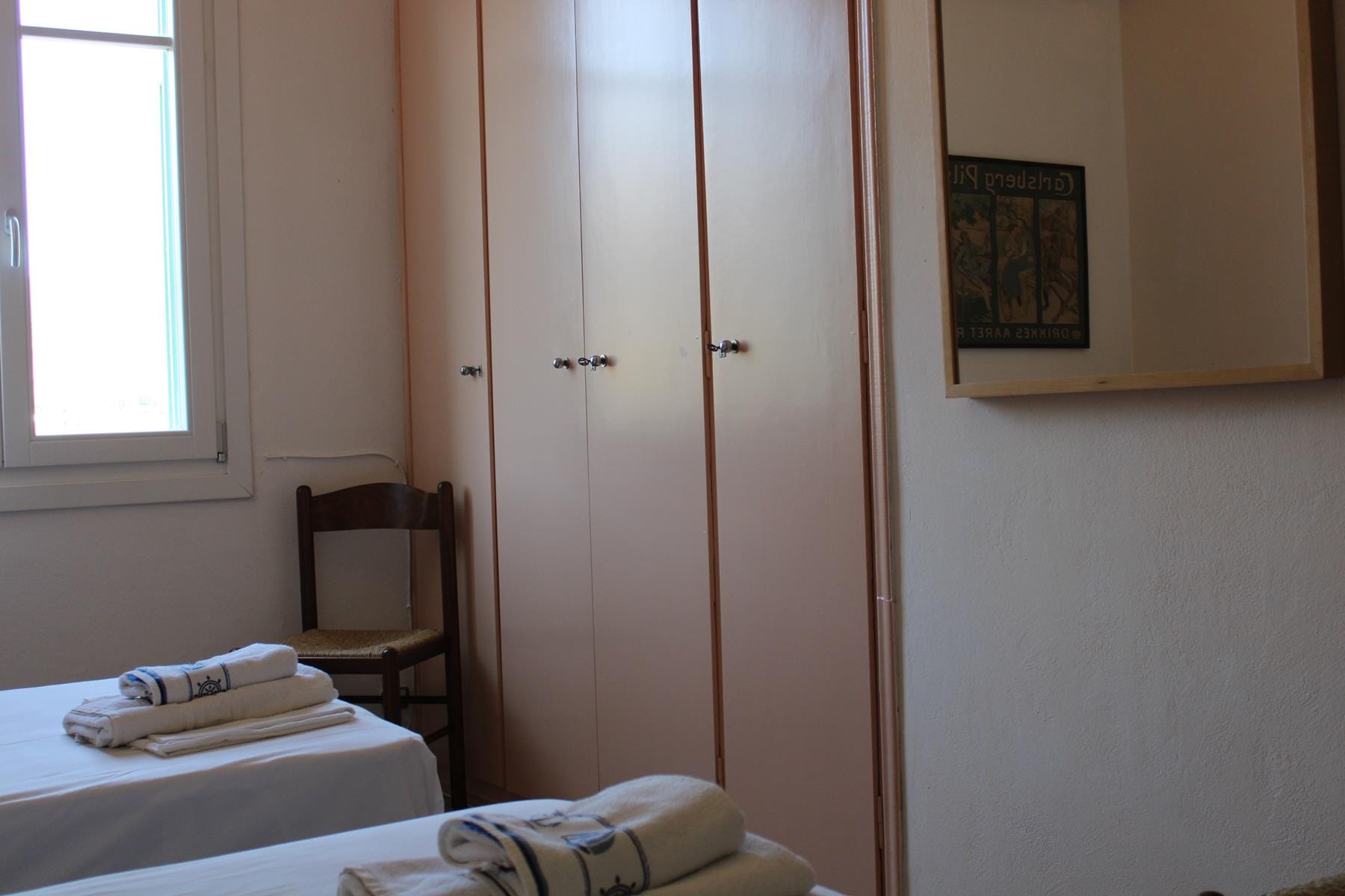 a room with a bed and a chair