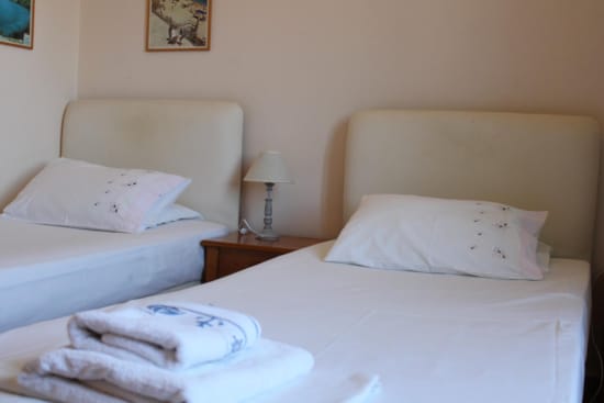 a bed with white sheets