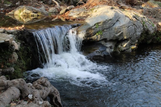 a small waterfall over rocks