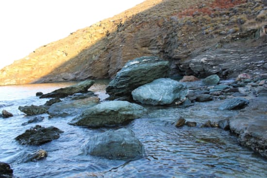 a rocky beach with water