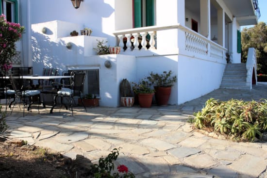 a patio with tables and chairs