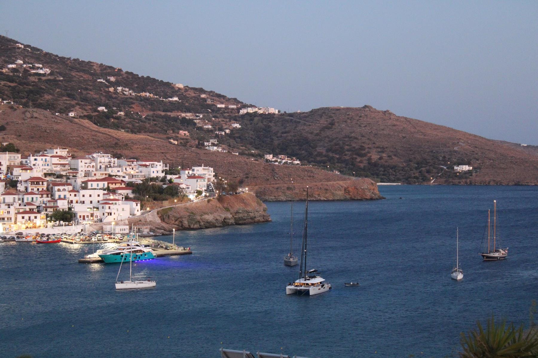 a body of water with boats and buildings along it