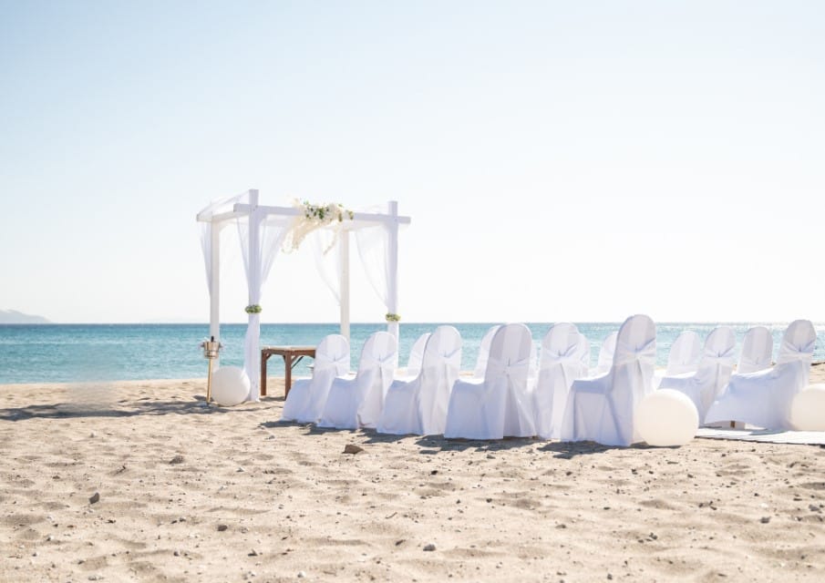 a row of chairs on a beach