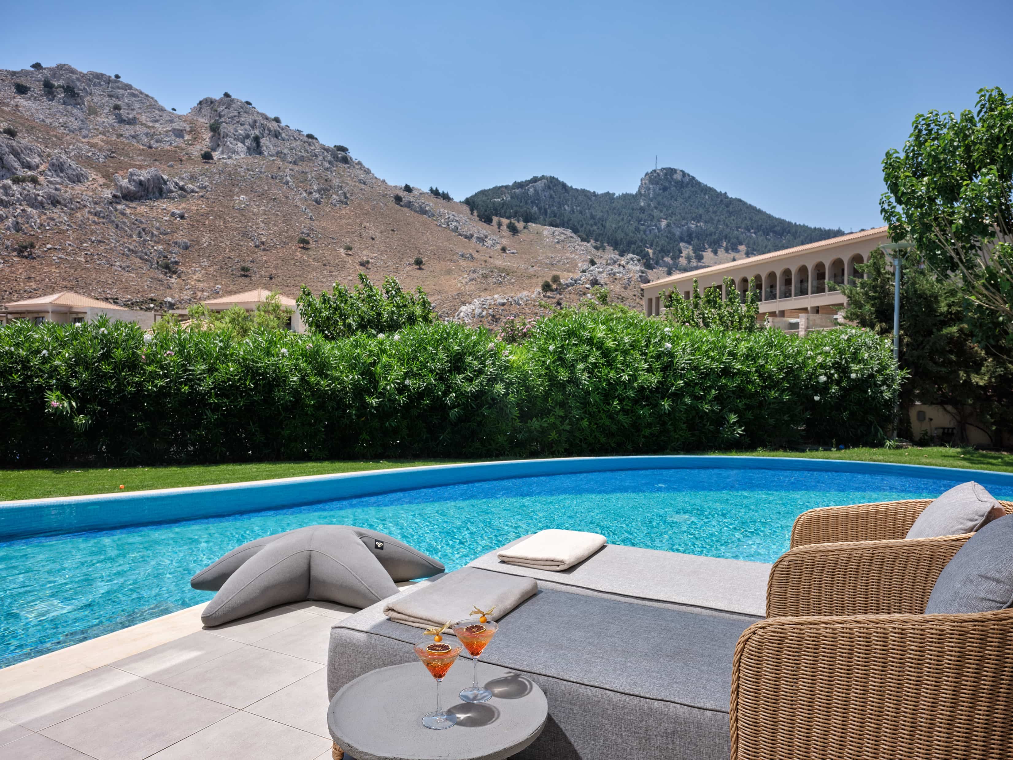 a pool with chairs around it