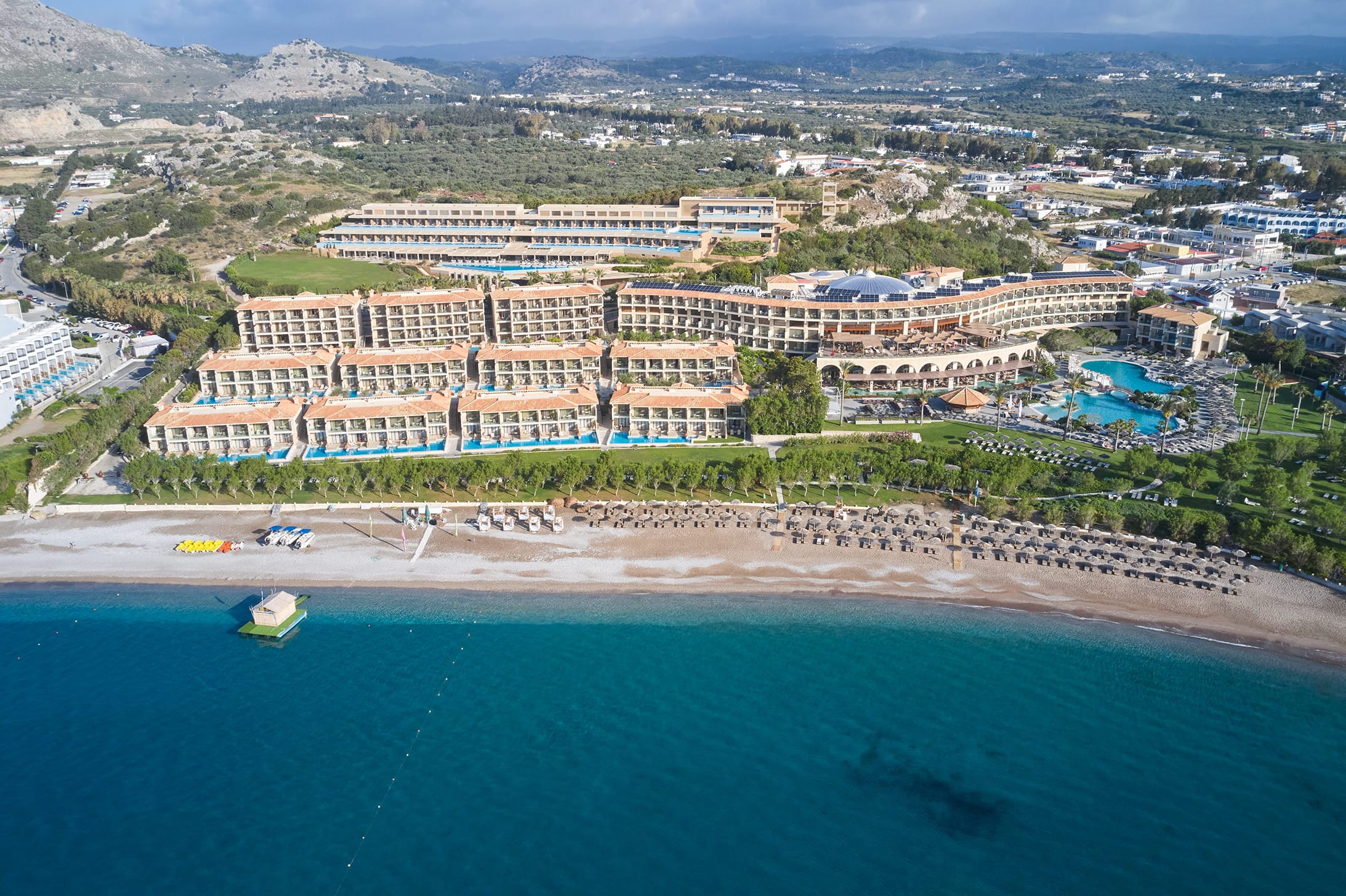 a large building next to a beach