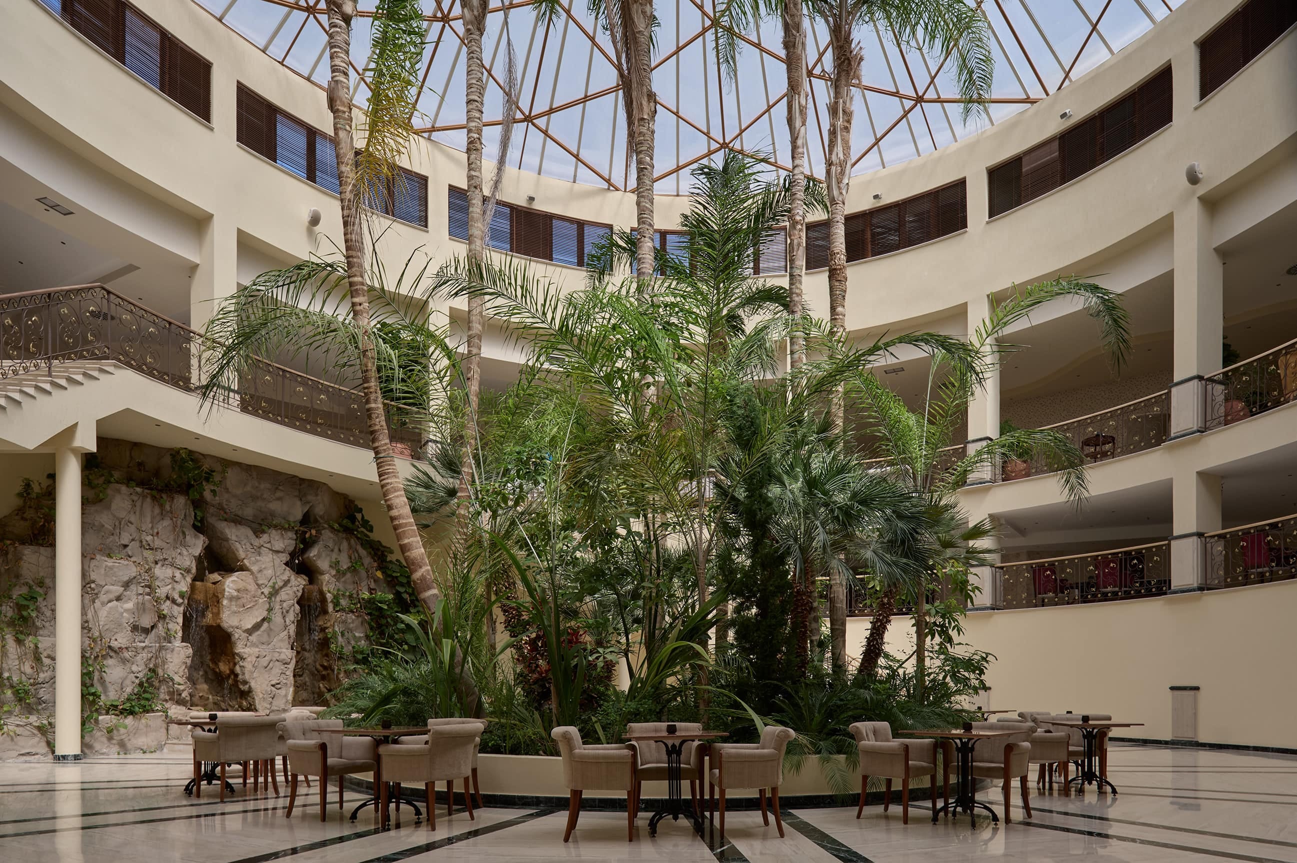 a courtyard with tables and chairs