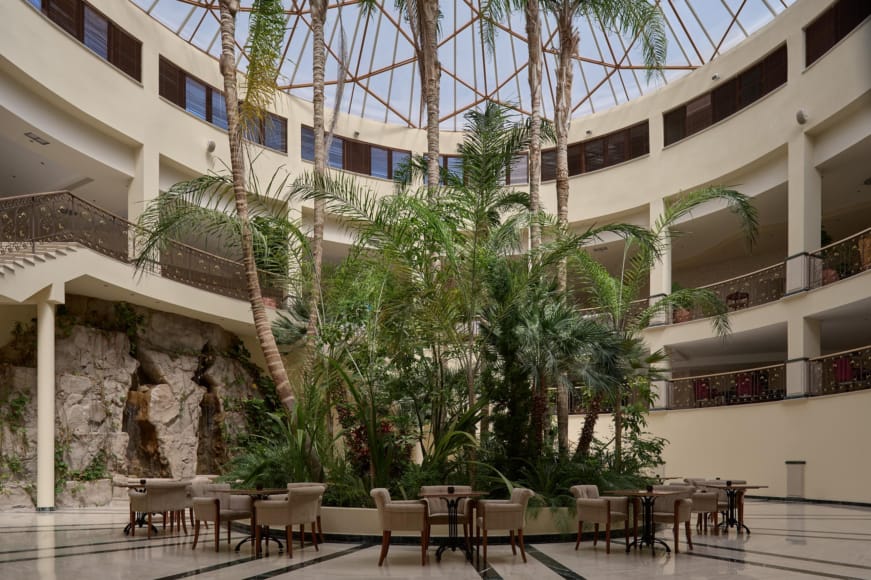 a courtyard with tables and chairs
