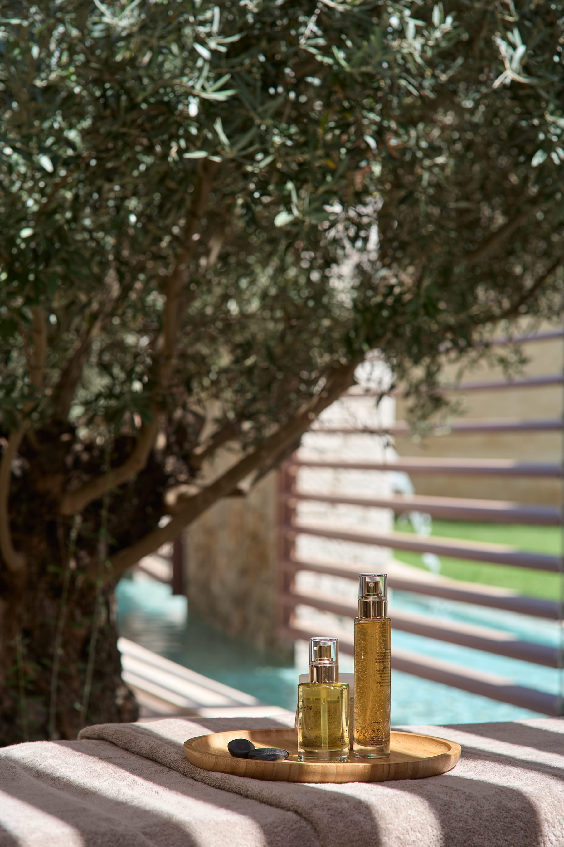 a table with bottles on it by a tree