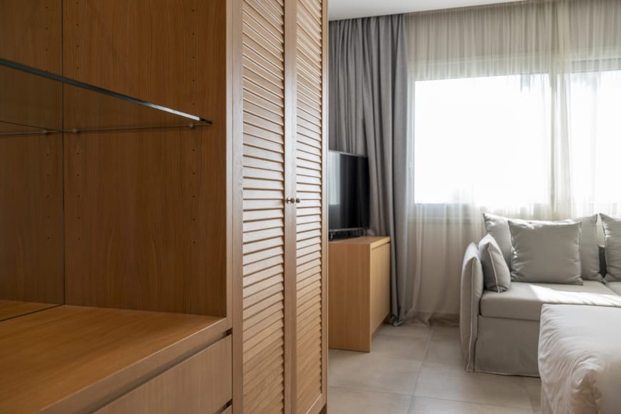 a room with a bed and a tv