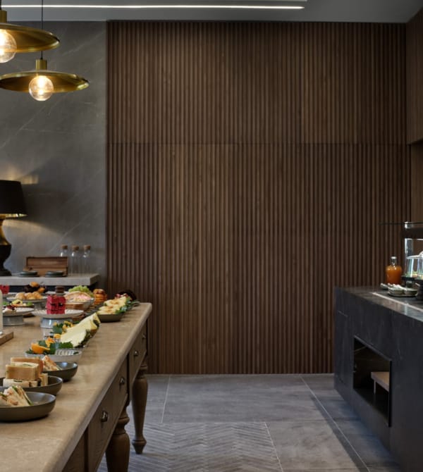 a kitchen with a table and a counter with food on it