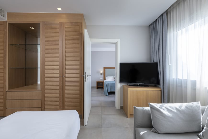 a room with a bed and a tv