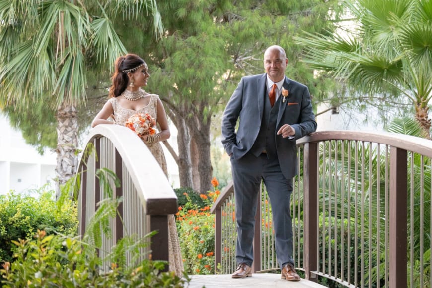 a man and woman walking on a bridge