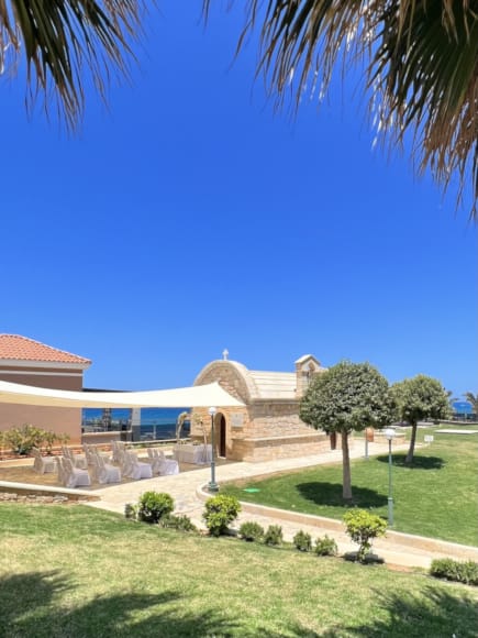 a building with a lawn and trees