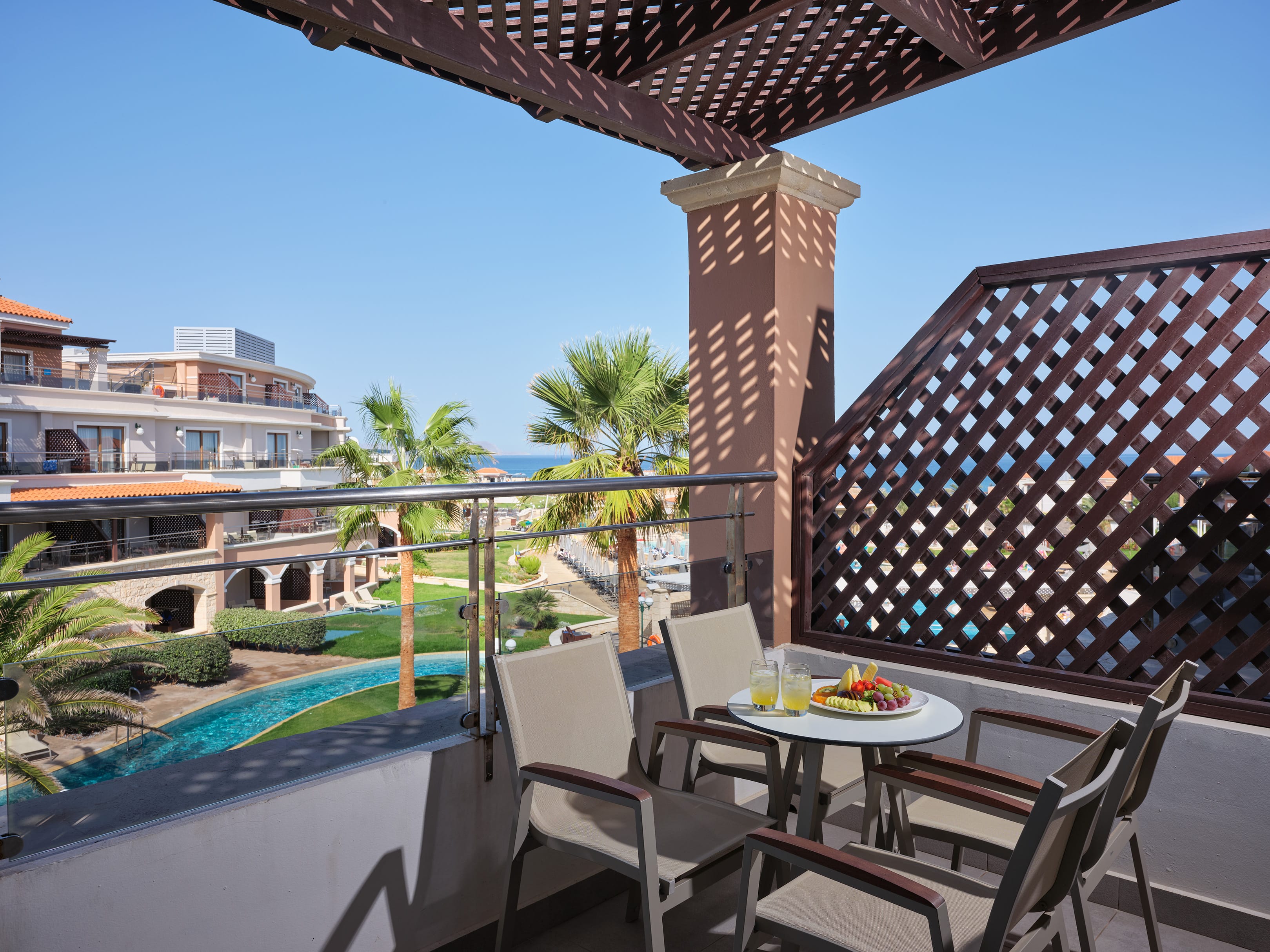 a table and chairs on a balcony