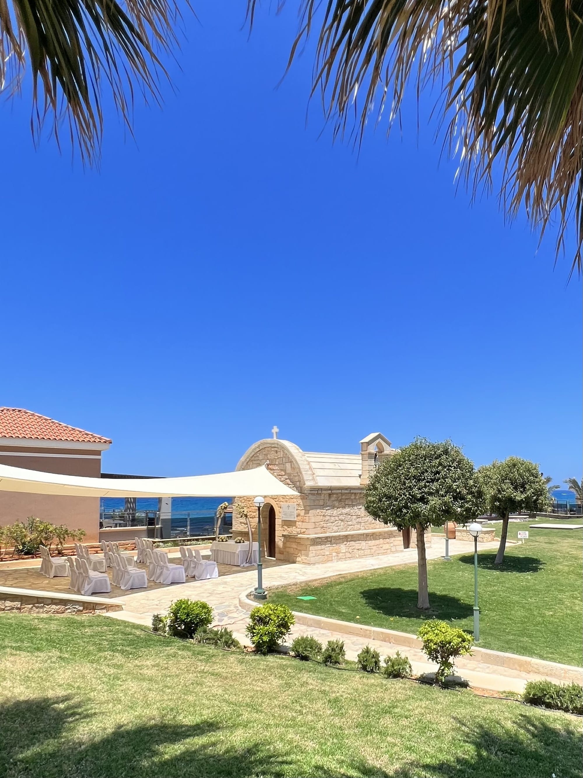 a building with a lawn and trees