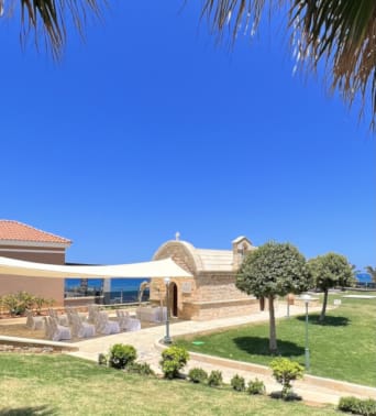 a building with a lawn and trees