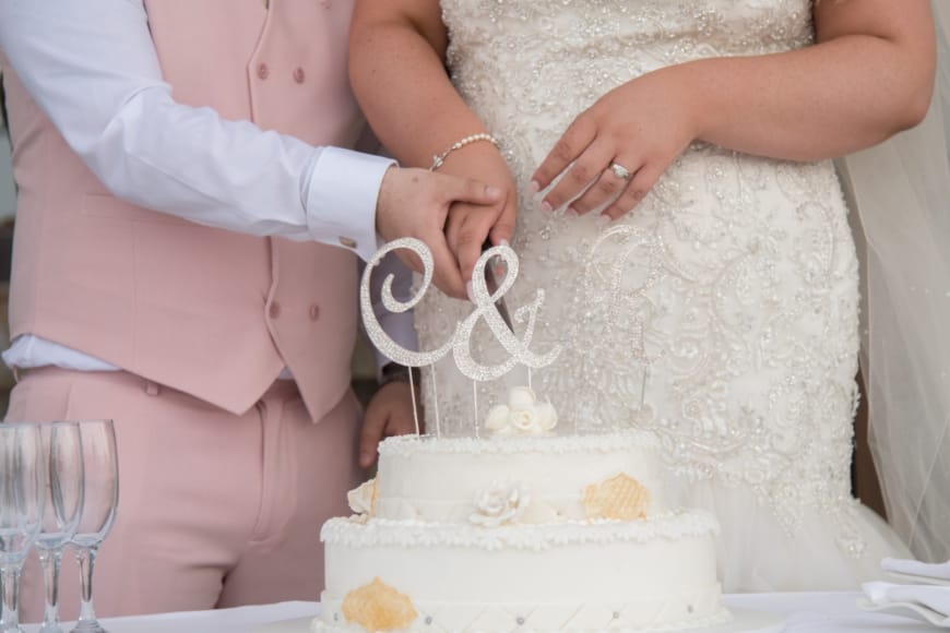 a woman cutting a cake