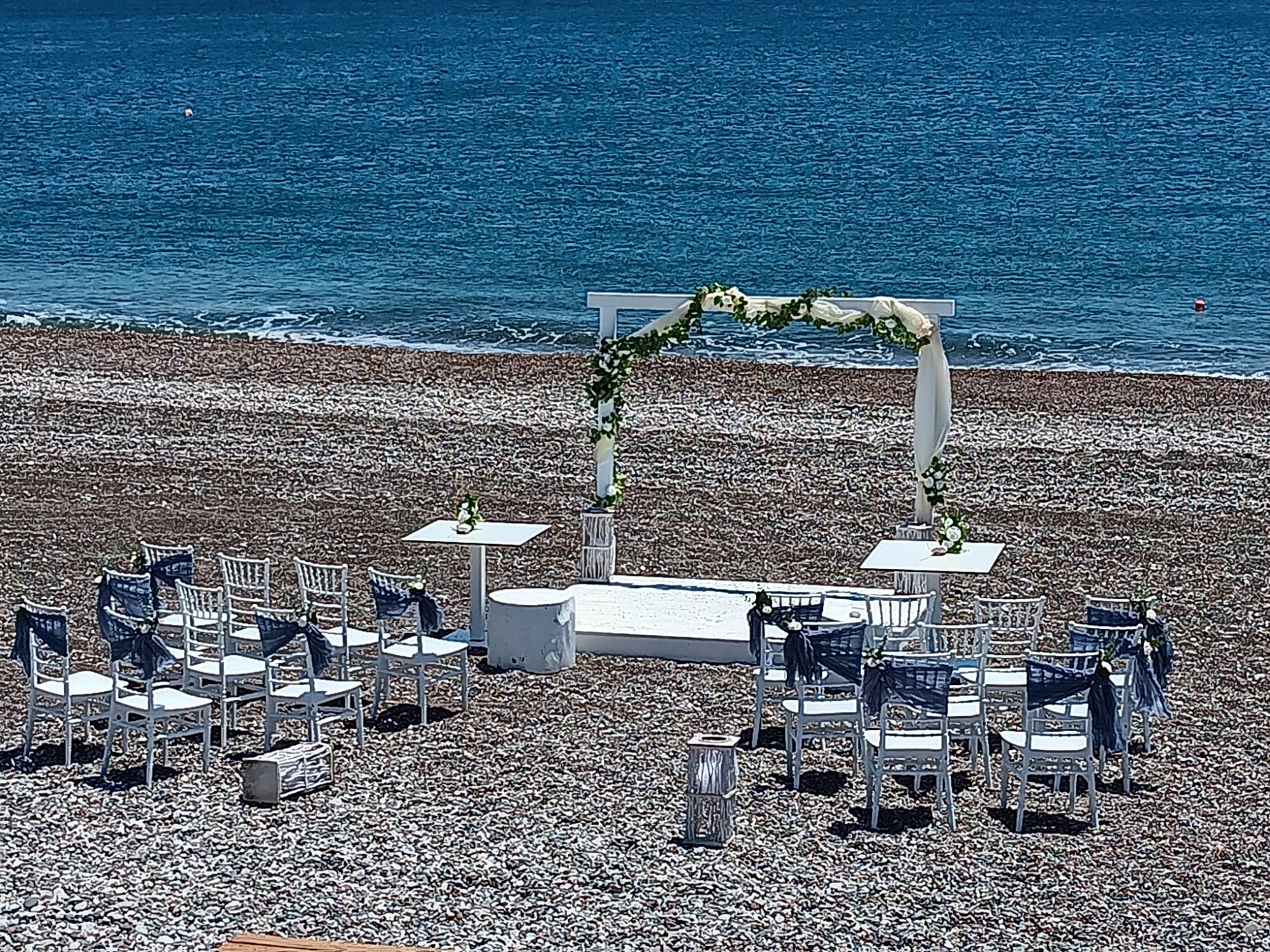 tables and chairs on a beach
