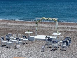 tables and chairs on a beach