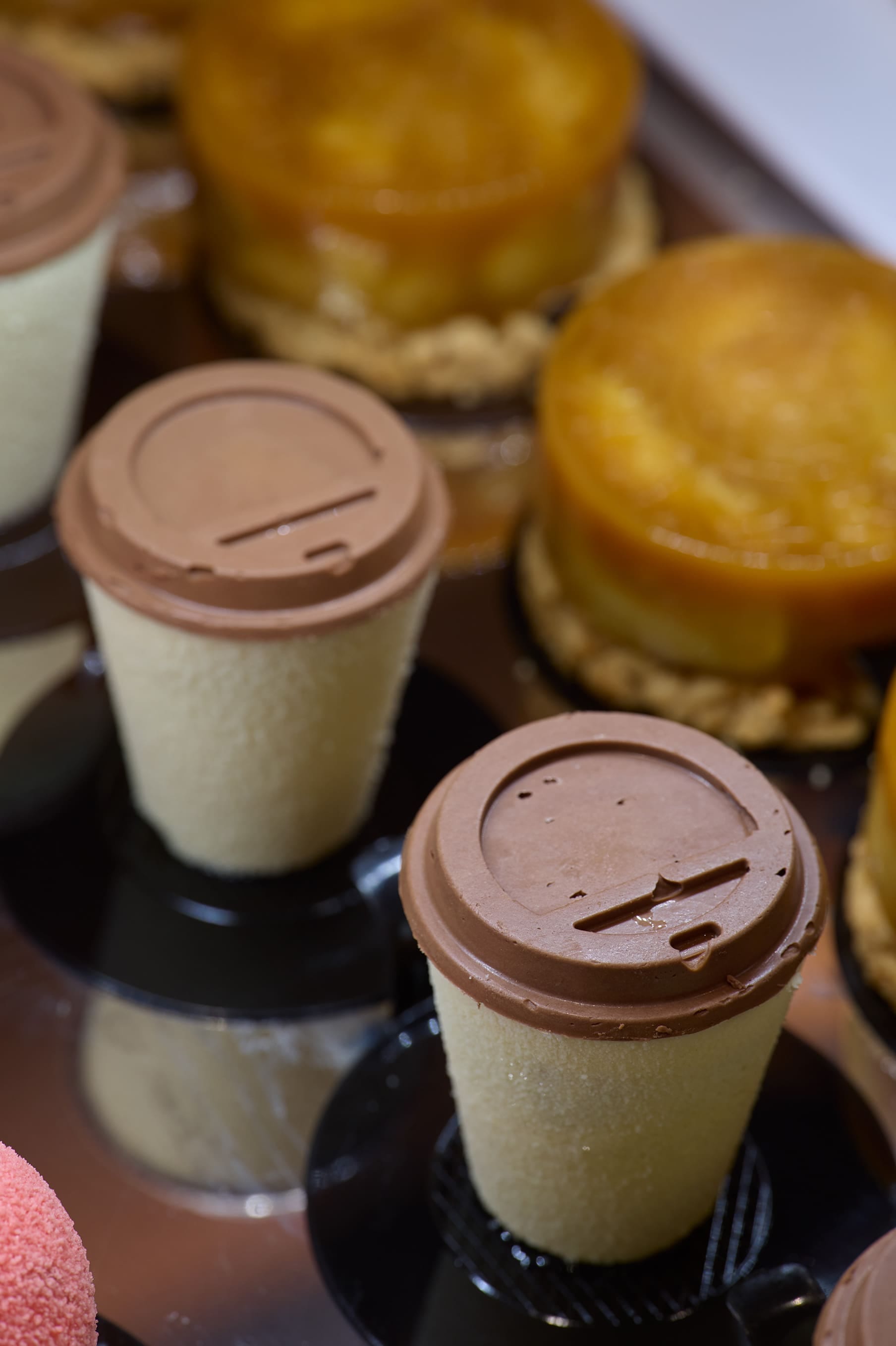 a group of glass jars with brown liquid in them