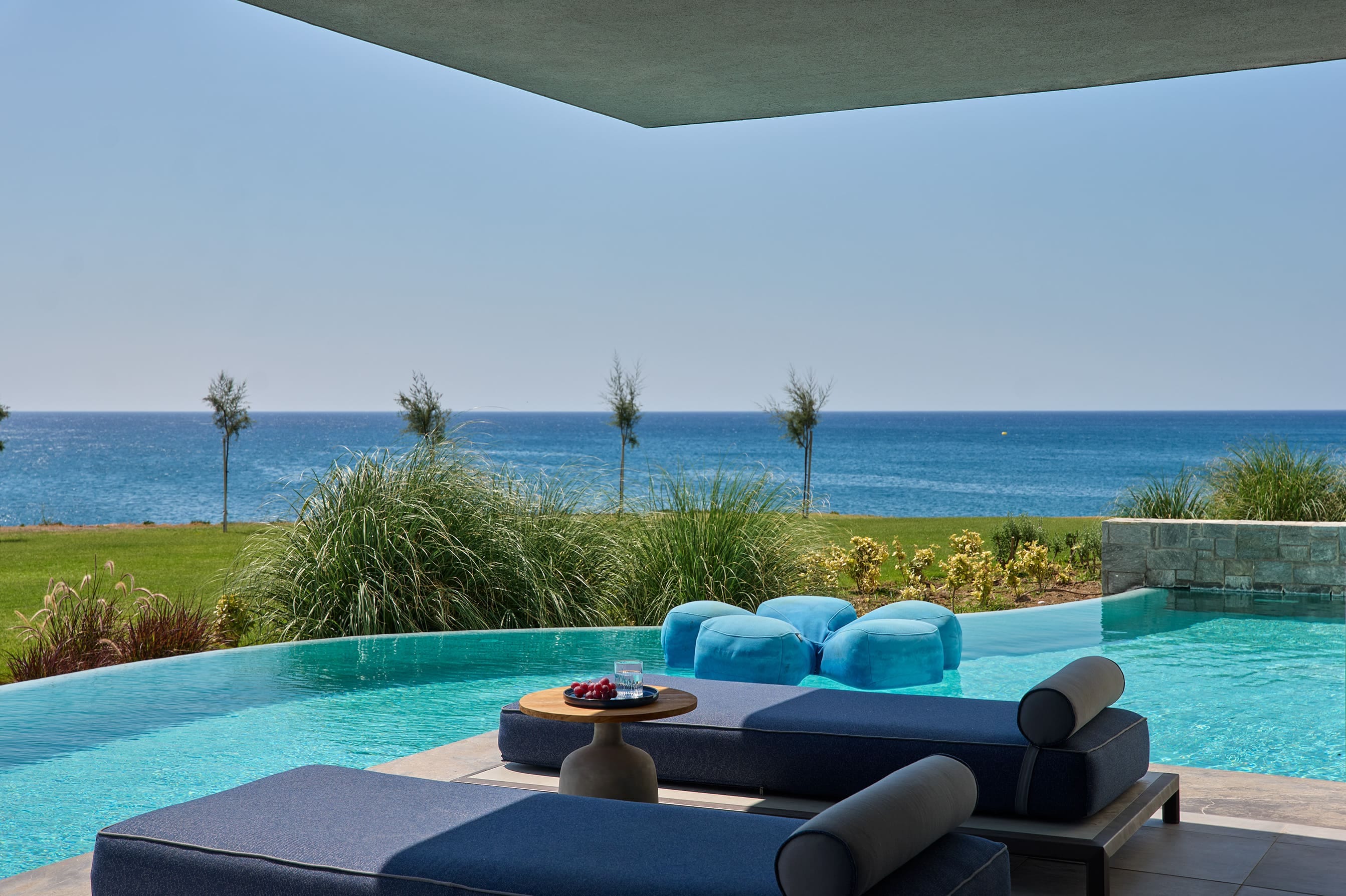 a pool with chairs and a table
