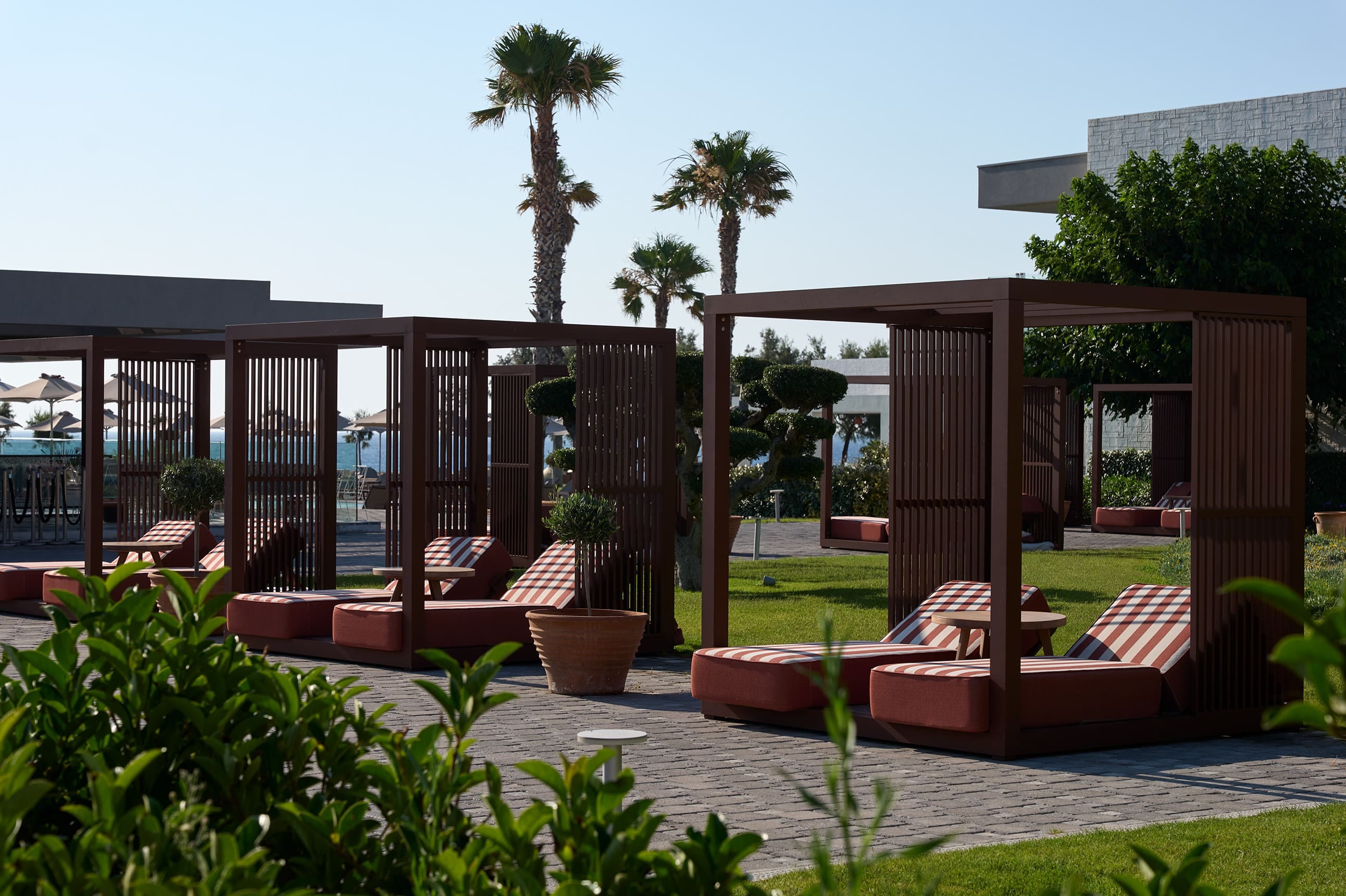 a patio with a deck and trees