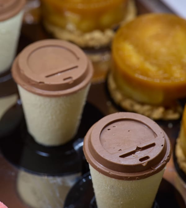 a group of glass jars with brown liquid in them