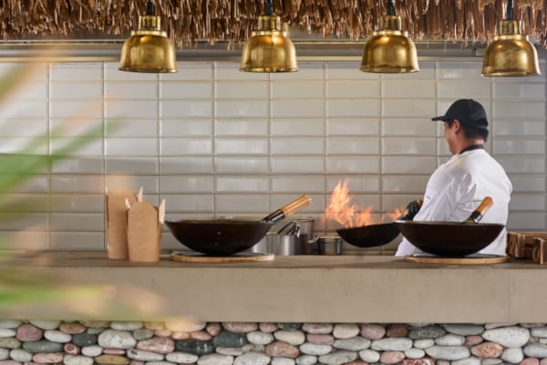 a person cooking food in a kitchen