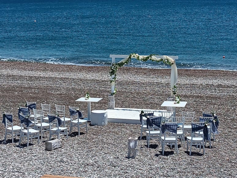 tables and chairs on a beach