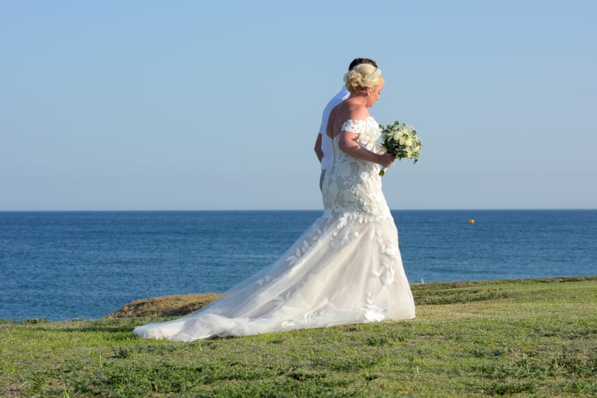 a man in a white dress