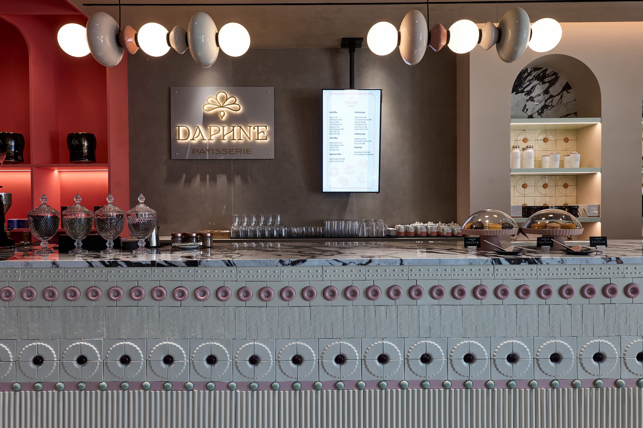 a counter with many bottles of liquid on it