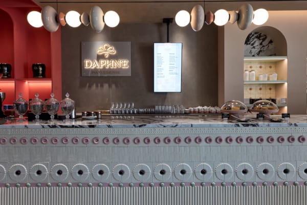 a counter with many bottles of liquid on it